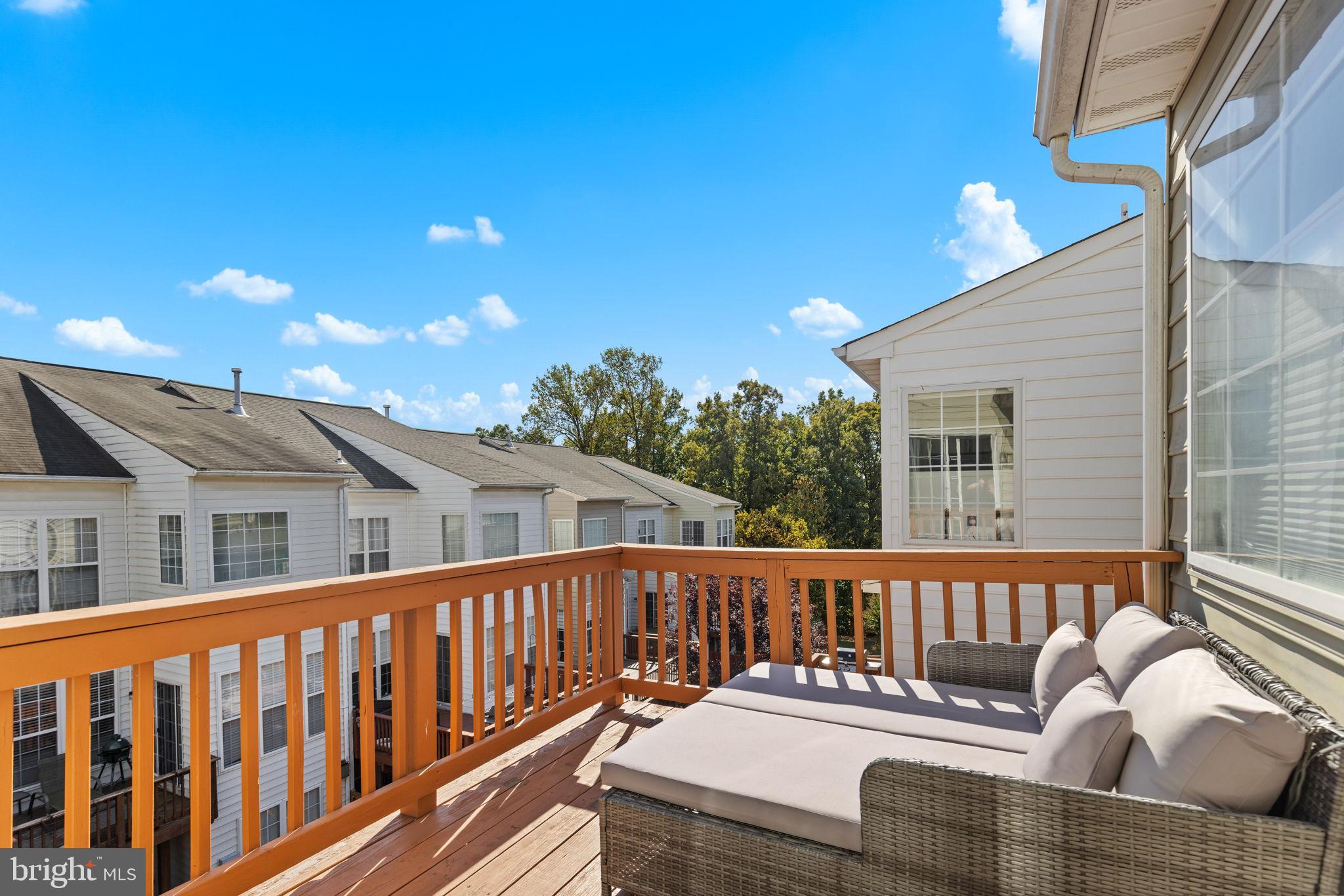 6311 Burgundy Leaf Lane Alexandria, VA 22312 - Photo 24 of 33 a view of a chair and tables front of the house