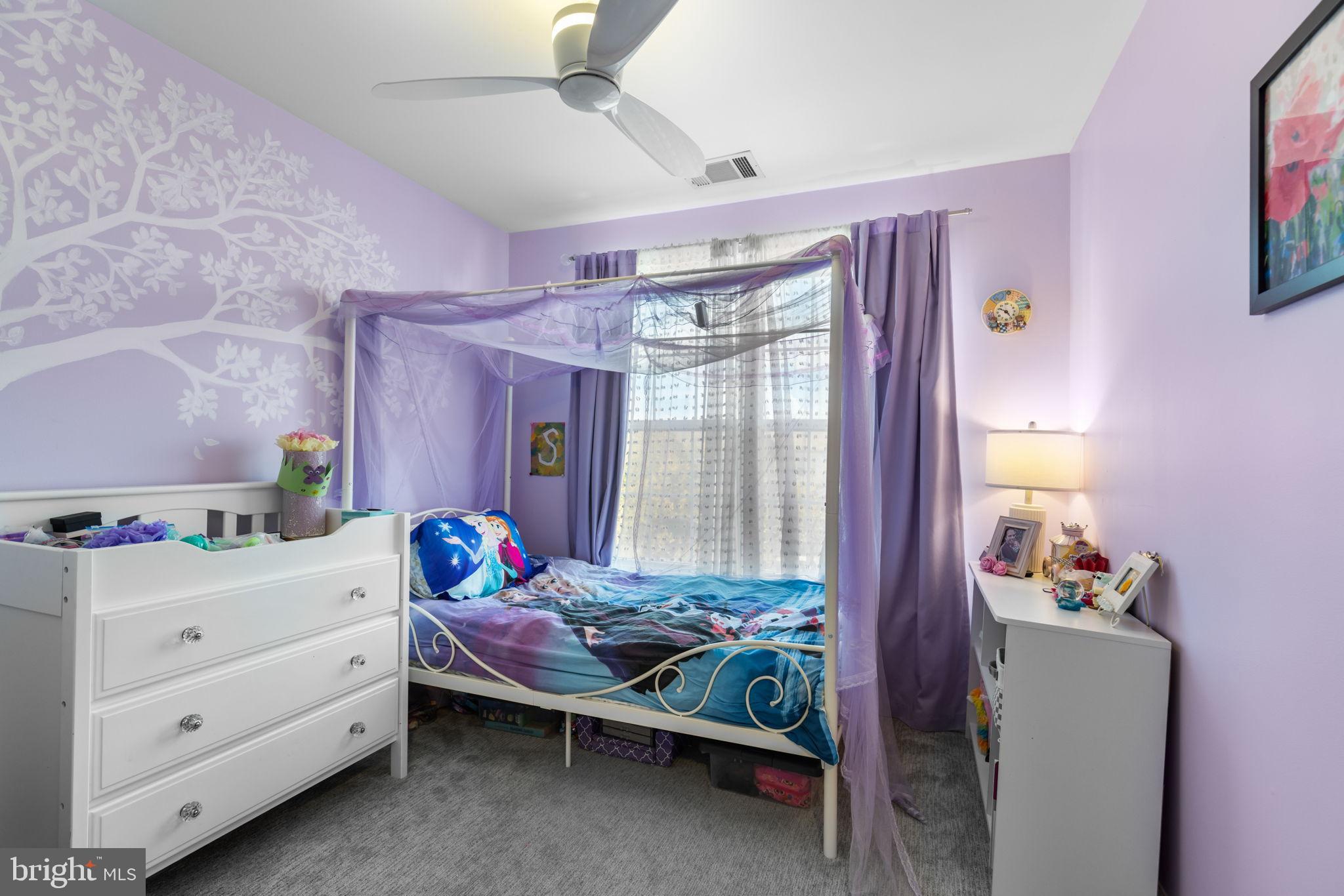 6311 Burgundy Leaf Lane Alexandria, VA 22312 - Photo 27 of 33 a bedroom with a bed and a window