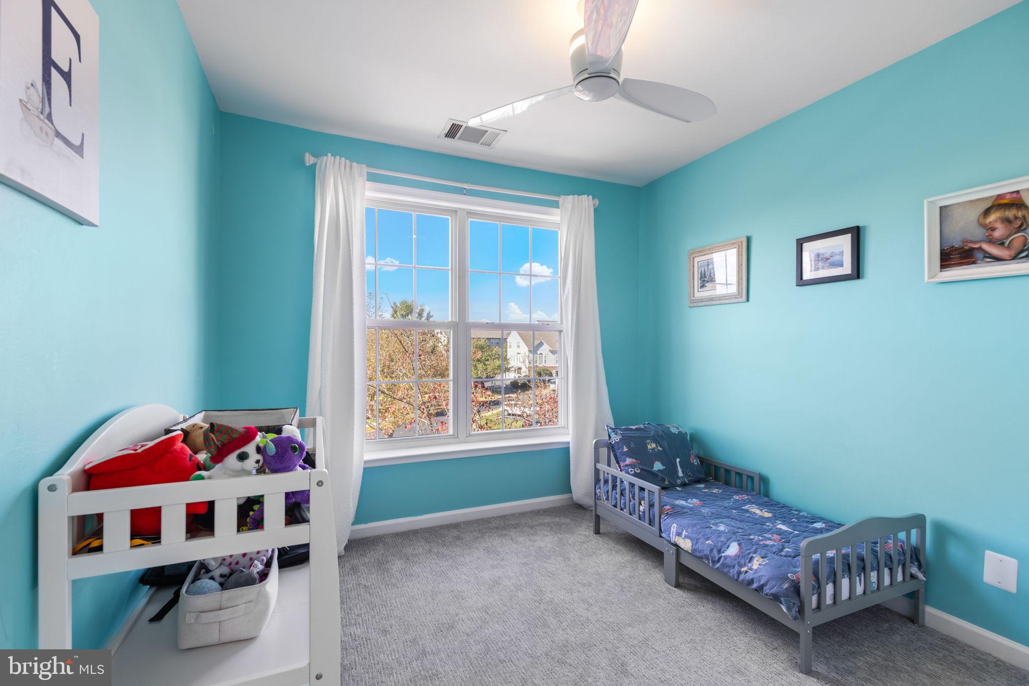 6311 Burgundy Leaf Lane Alexandria, VA 22312 - Photo 28 of 33 a bedroom with a bed and a window