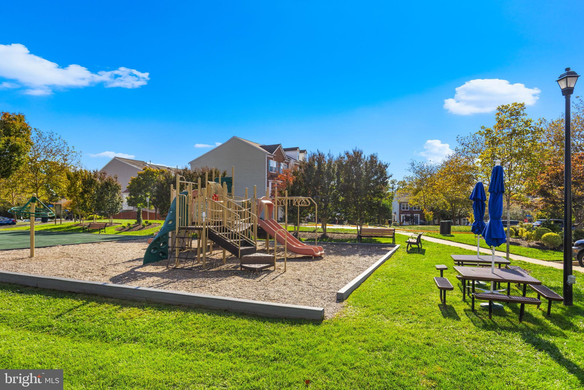 6311 Burgundy Leaf Lane Alexandria, VA 22312 - Photo 32 of 33 a view of a park with swings and slides
