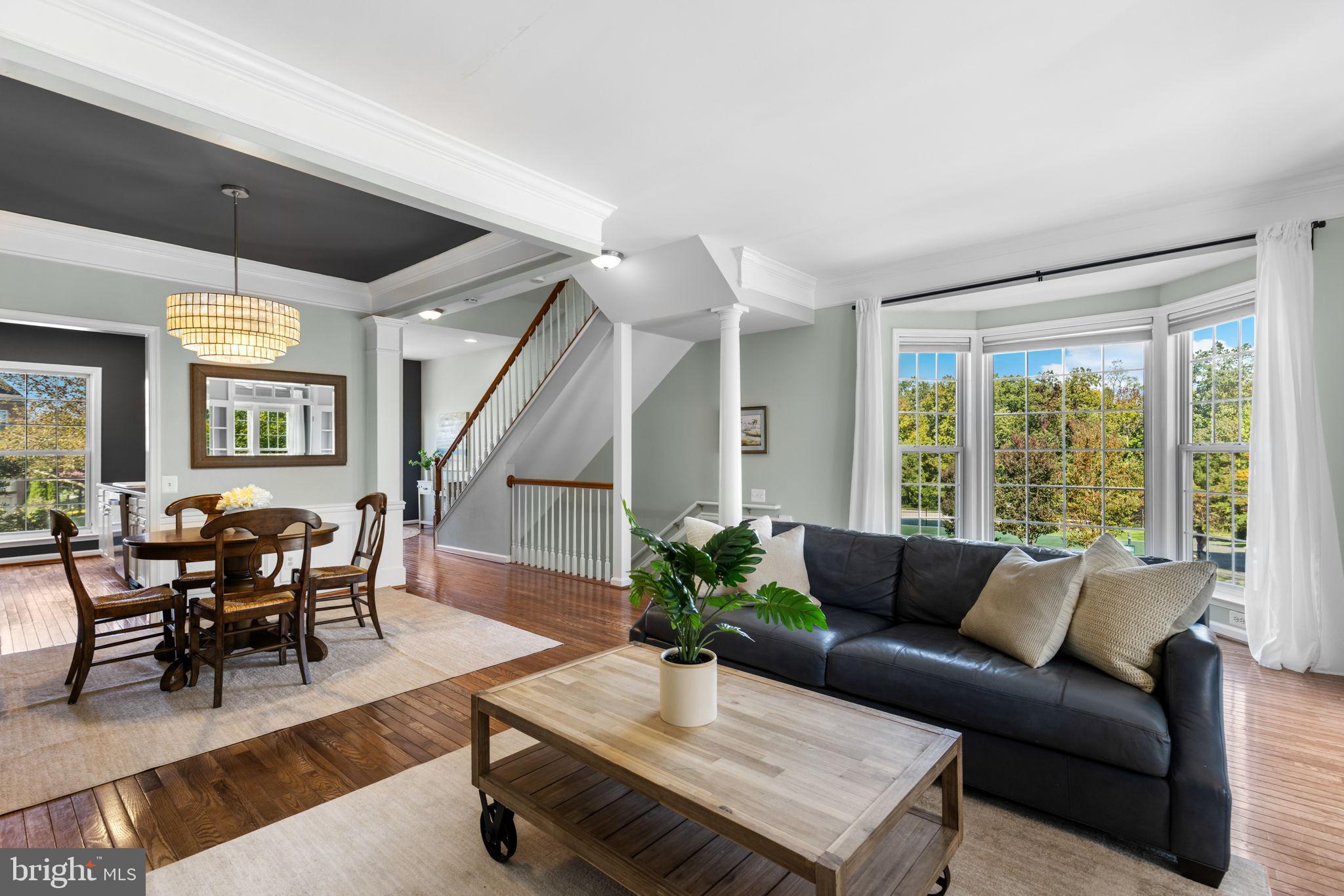 6311 Burgundy Leaf Lane Alexandria, VA 22312 - Photo 3 of 33 a living room with furniture and a large window