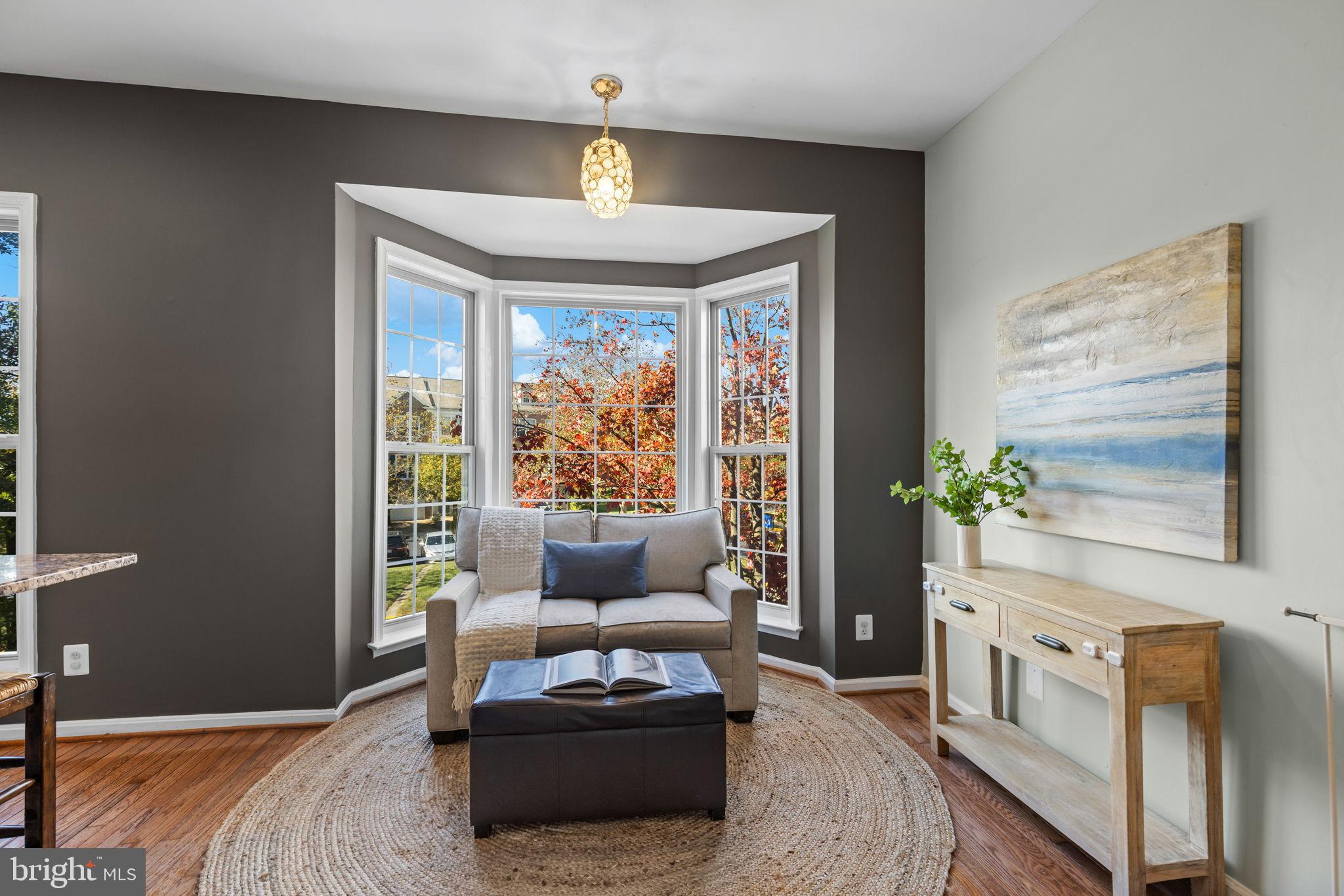 6311 Burgundy Leaf Lane Alexandria, VA 22312 - Photo 6 of 33 a living room with furniture and a window