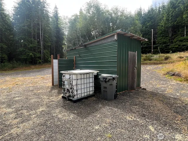 a house that has a tree in front of it