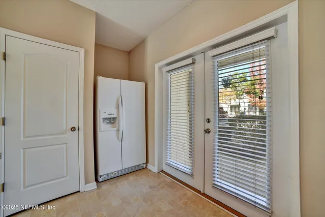 a view of room with windows and bathroom view