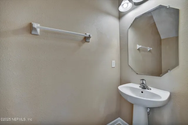 a view of workspace with window and a flat screen tv