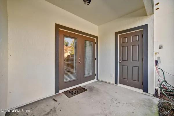 a view of room with windows and bathroom view