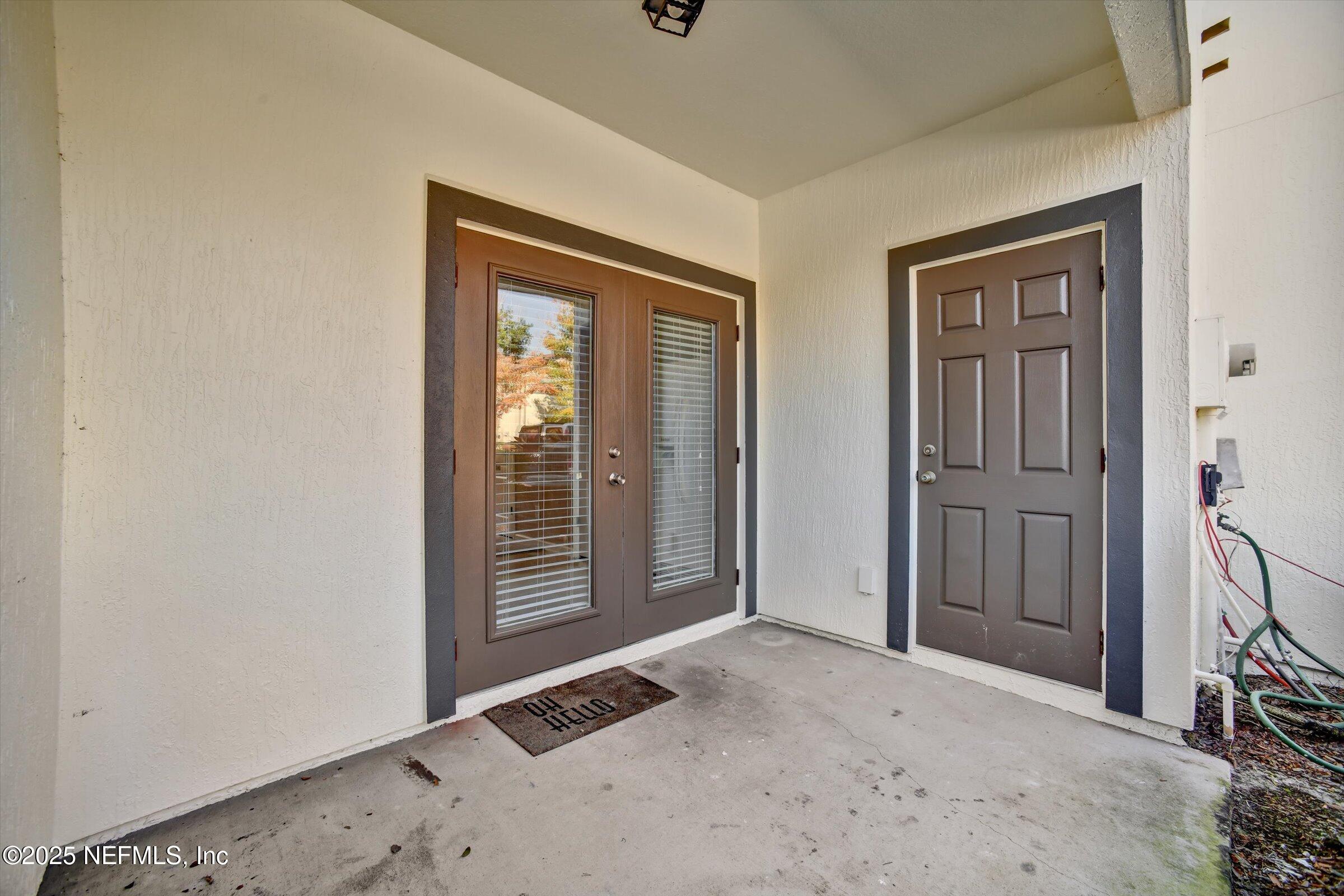 480 Cabernet Place St. Augustine, FL 32084 - Photo 17 of 37 a view of an empty room with wooden floor and windows