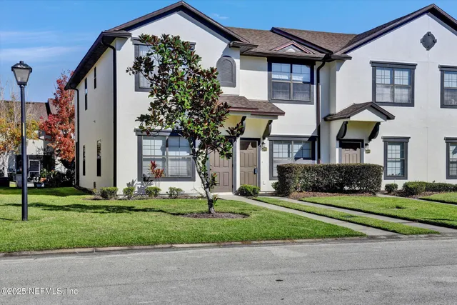 a view of a house with a backyard porch and sitting area