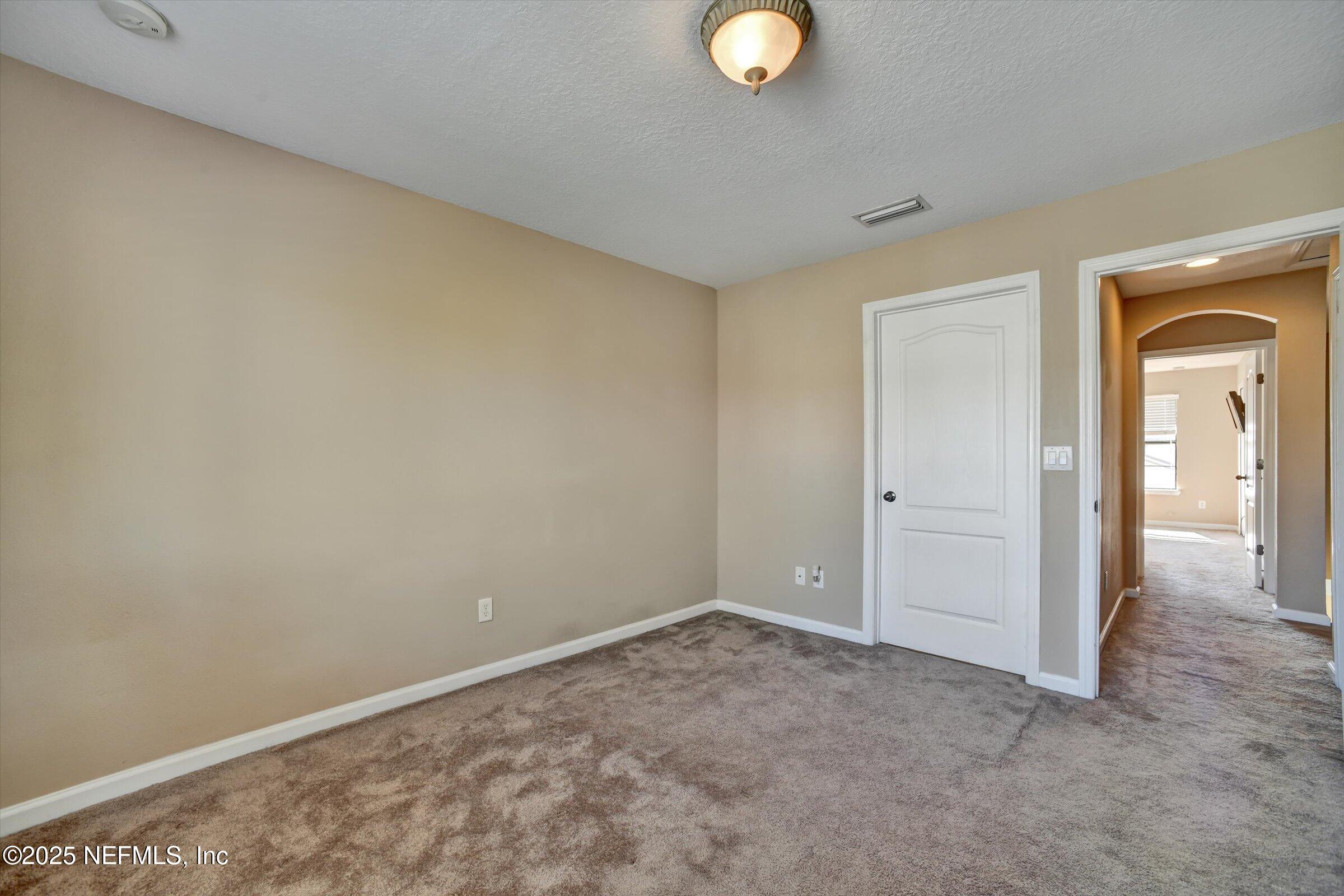 480 Cabernet Place St. Augustine, FL 32084 - Photo 28 of 37 a view of an empty room and window