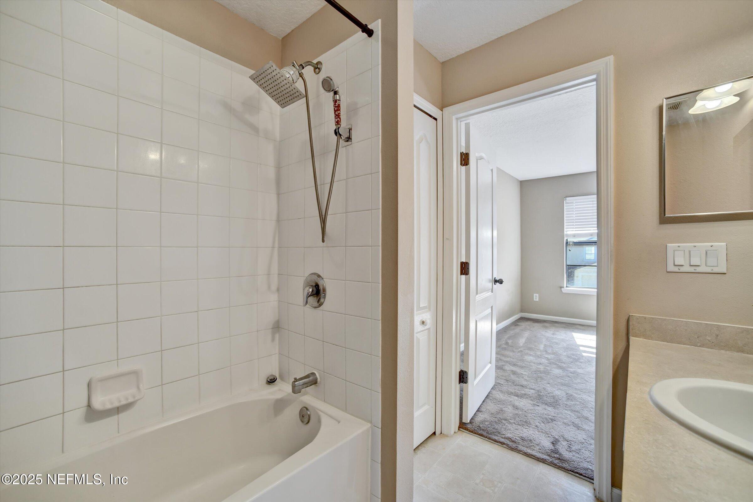 480 Cabernet Place St. Augustine, FL 32084 - Photo 35 of 37 a bathroom with a bathtub and a shower