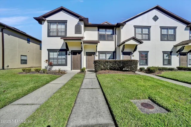 a front view of a house with a glass door