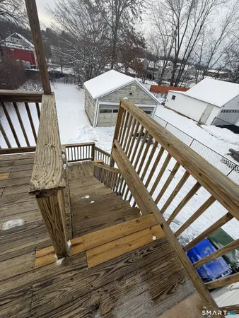 a view of balcony with wooden floor