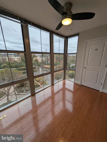 a view of an entryway with wooden floor