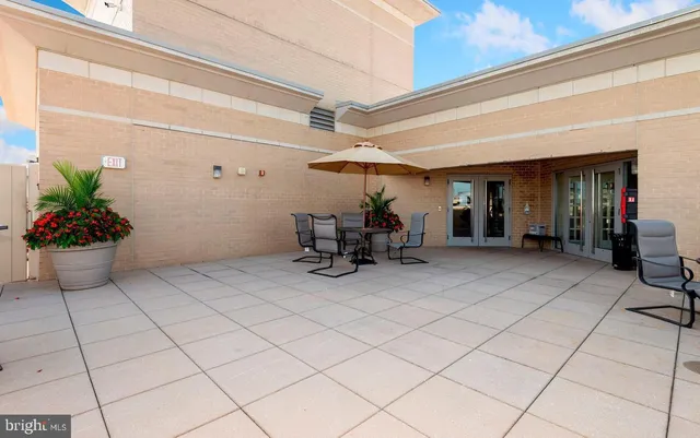 a view of a chairs and table in a patio