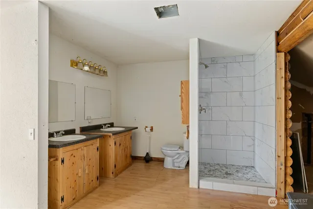a view of a storage & utility room with two washing machine