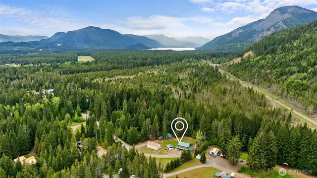 a view of a back yard from a swimming pool