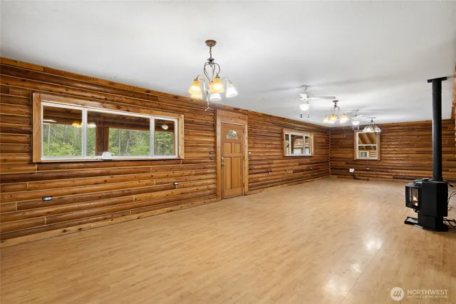 a view of a livingroom with furniture and a window