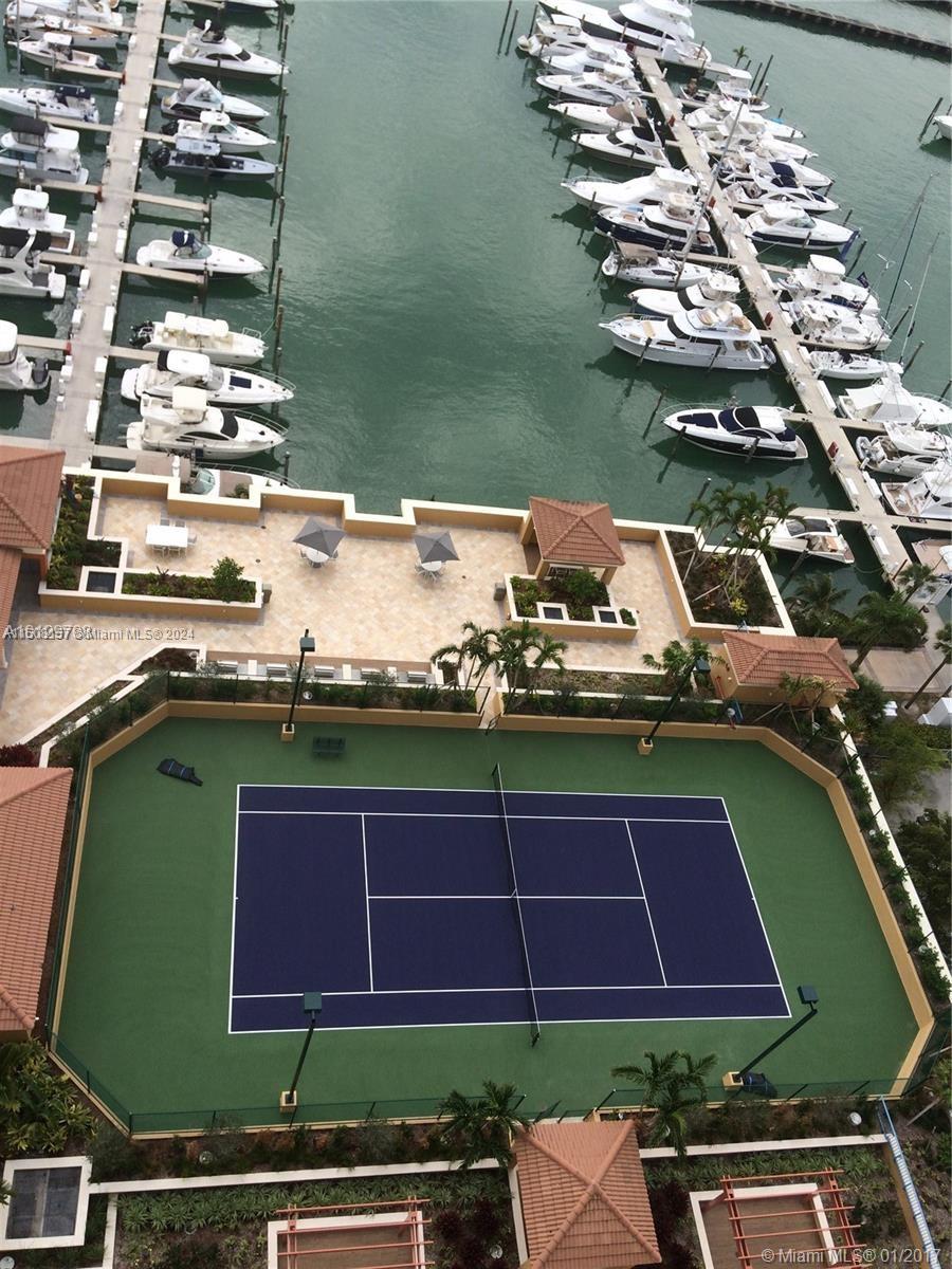 90 Alton Road, Unit 2503 Miami Beach, FL 33139 - Photo 16 of 23 a view of a chairs and table on the terrace