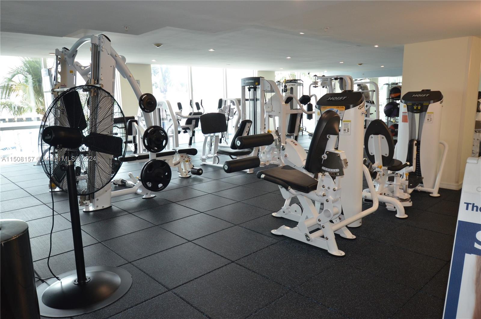 90 Alton Road, Unit 2503 Miami Beach, FL 33139 - Photo 17 of 23 a view of a room with gym equipment