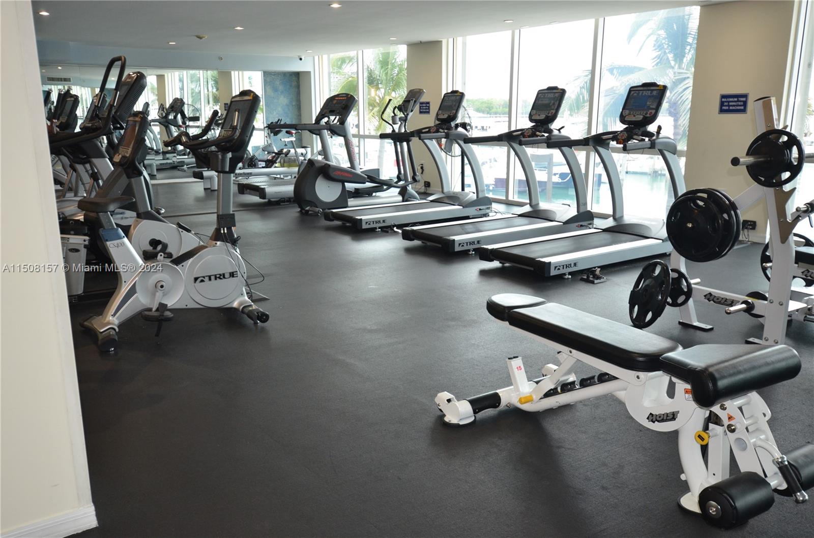 90 Alton Road, Unit 2503 Miami Beach, FL 33139 - Photo 18 of 23 a view of a room with gym equipment