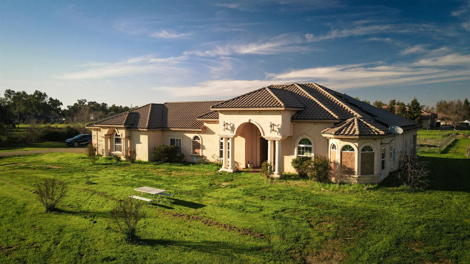 a front view of a house with a yard