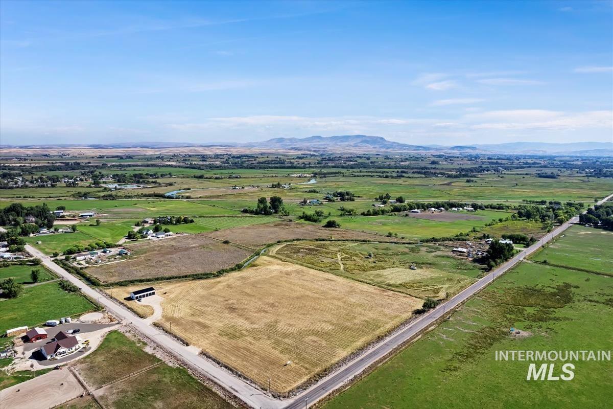 2670 Berglund Road Emmett, ID 83617 - Photo 3 of 22 Aerial view of sparsely populated area featuring a mountain backdrop