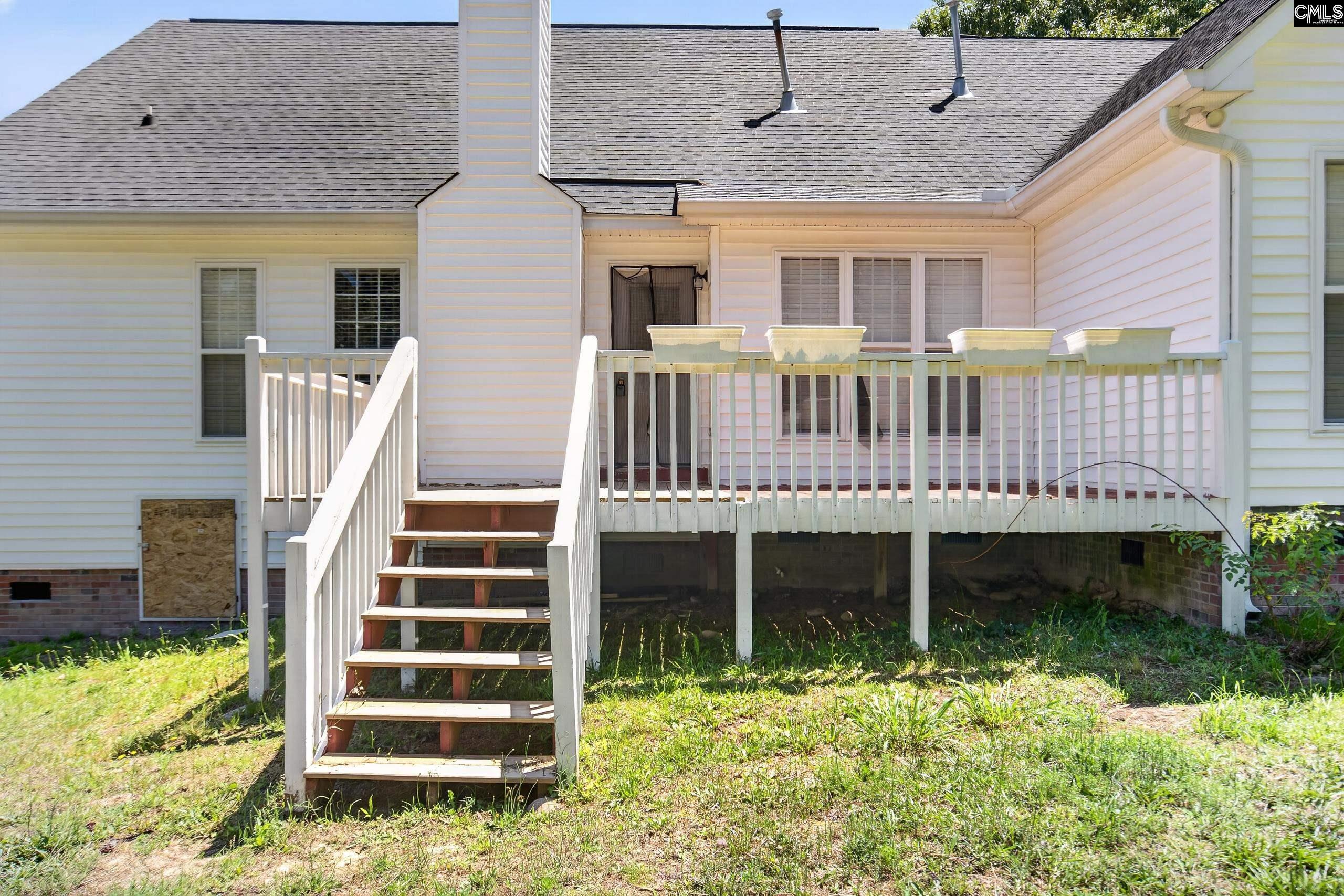 219 Plantation Pointe Drive Elgin, SC 29045 - Photo 42 of 56 a view of a house with wooden deck and a yard
