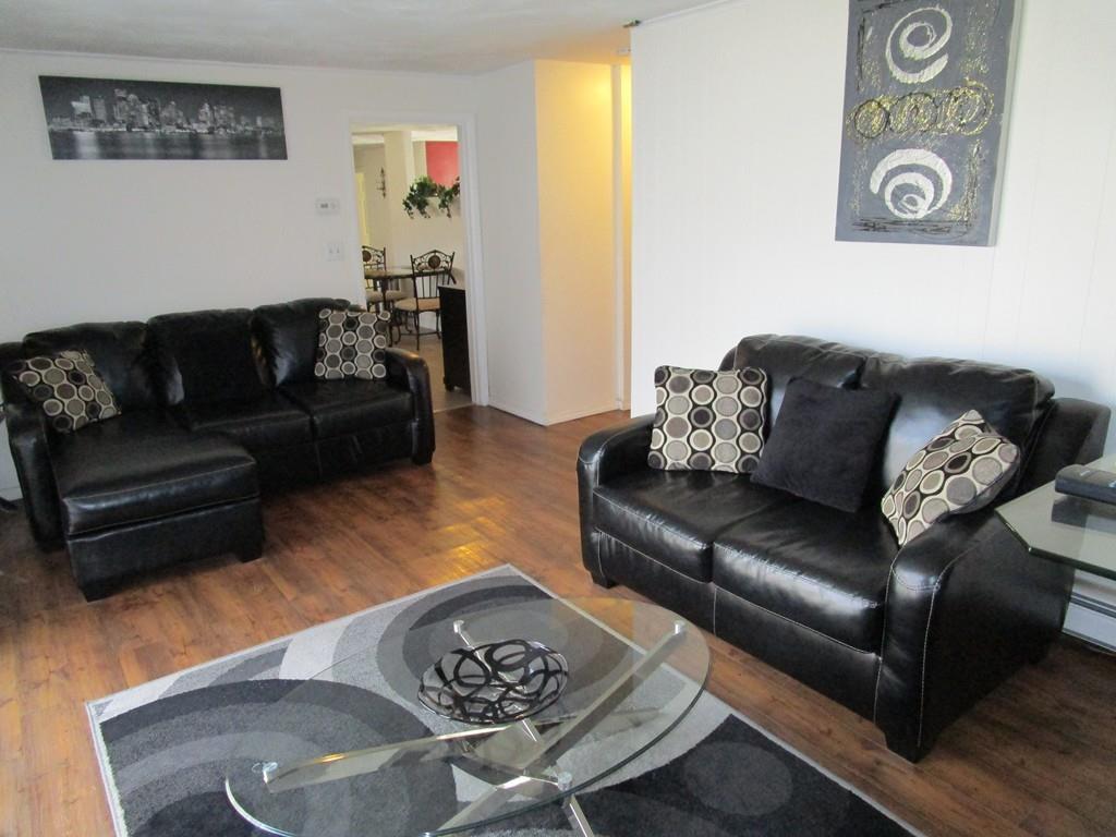84 Temi Road Brockton, MA 02302 - Photo 14 of 28 a living room with furniture and wooden floor