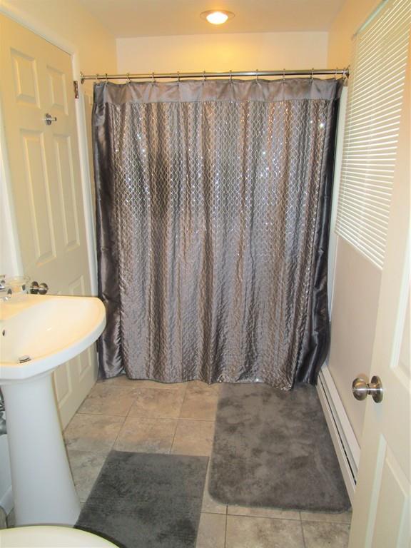 84 Temi Road Brockton, MA 02302 - Photo 18 of 28 a bathroom with a shower curtain and a sink