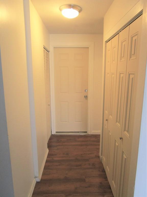 84 Temi Road Brockton, MA 02302 - Photo 22 of 28 a view of a hallway with wooden floor