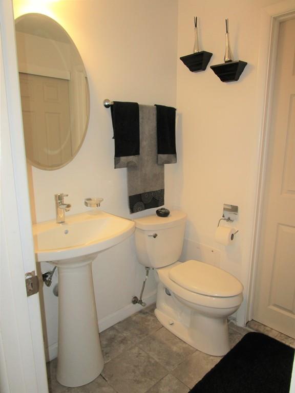 84 Temi Road Brockton, MA 02302 - Photo 23 of 28 a bathroom with a sink toilet and a mirror
