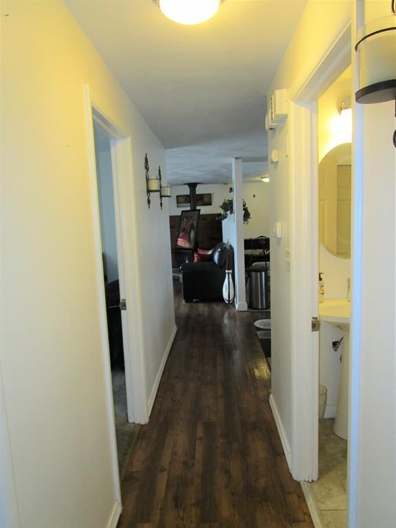 84 Temi Road Brockton, MA 02302 - Photo 25 of 28 a view of a hallway with furniture and a refrigerator