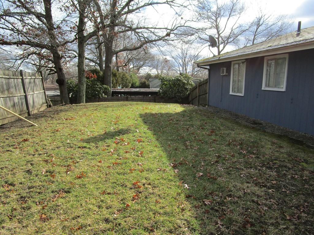 84 Temi Road Brockton, MA 02302 - Photo 28 of 28 a backyard of a house with lots of green space