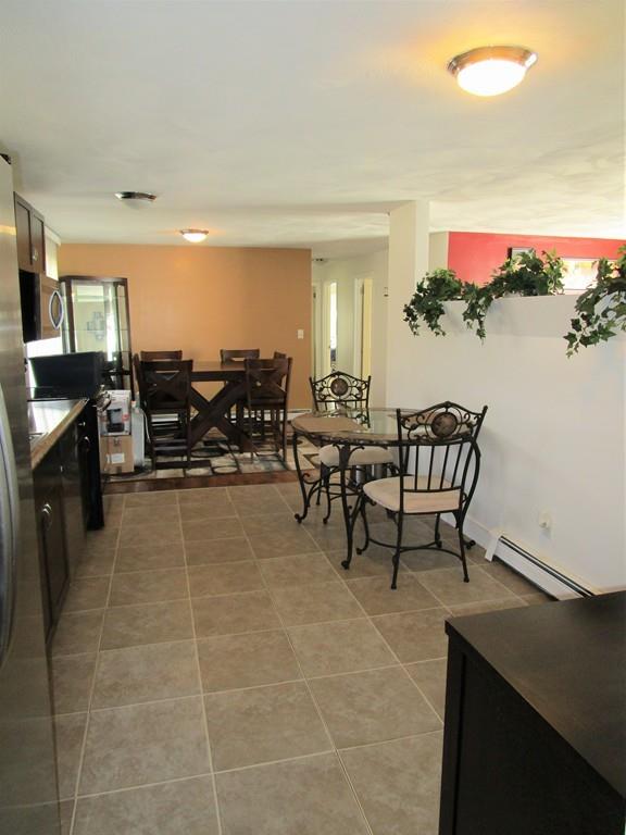 84 Temi Road Brockton, MA 02302 - Photo 7 of 28 a living room with furniture a window and a flat screen tv