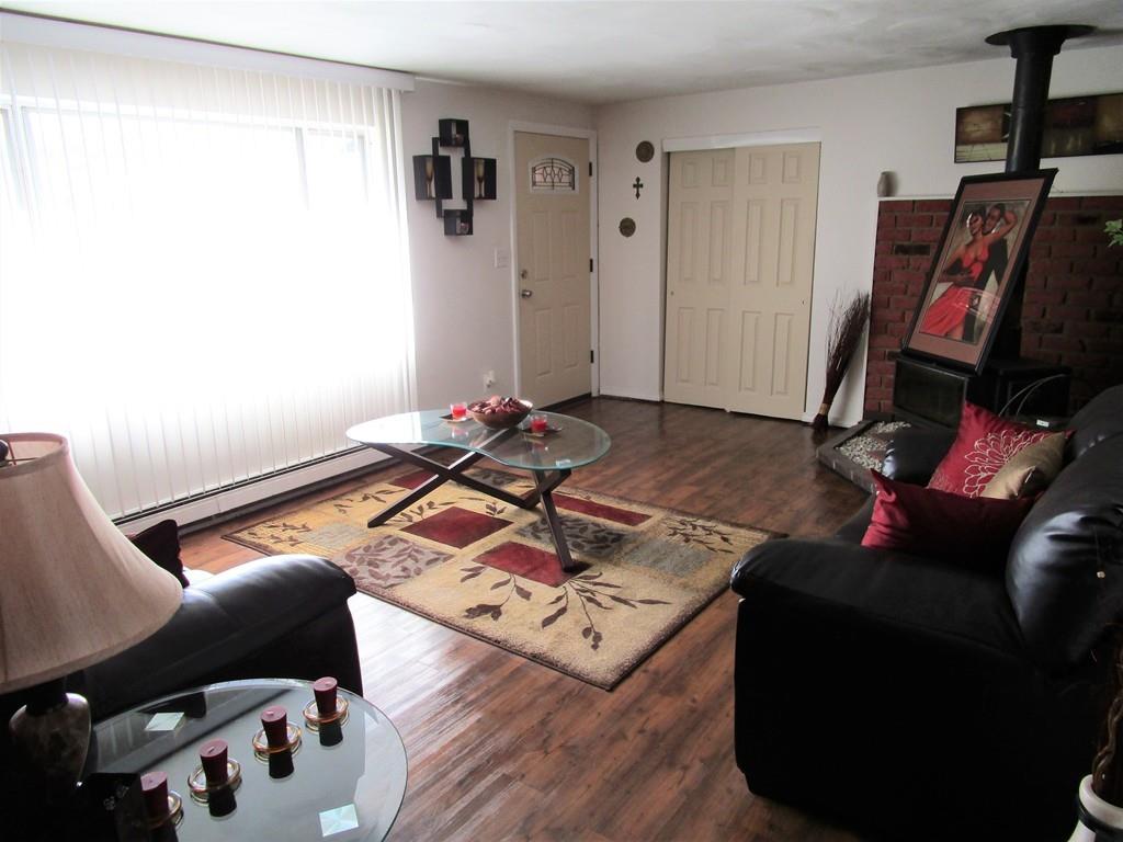 84 Temi Road Brockton, MA 02302 - Photo 10 of 28 a living room with furniture and a wooden floor
