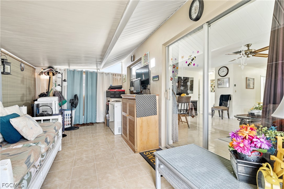 337 Richland Road Lehigh Acres, FL 33936 - Photo 19 of 31 a view of a livingroom with furniture and toys