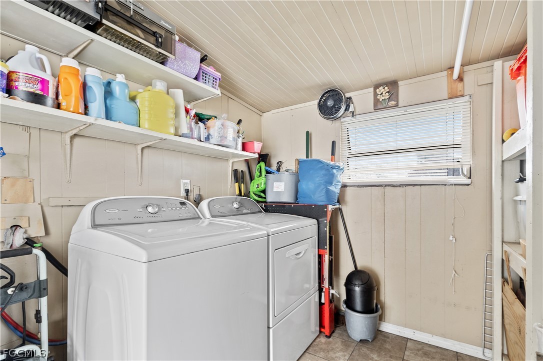 337 Richland Road Lehigh Acres, FL 33936 - Photo 21 of 31 a utility room with dryer and washer