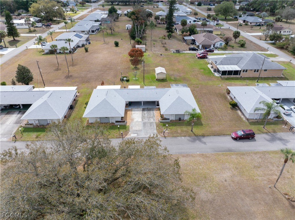 337 Richland Road Lehigh Acres, FL 33936 - Photo 25 of 31 an aerial view of a house with yard swimming pool and outdoor seating