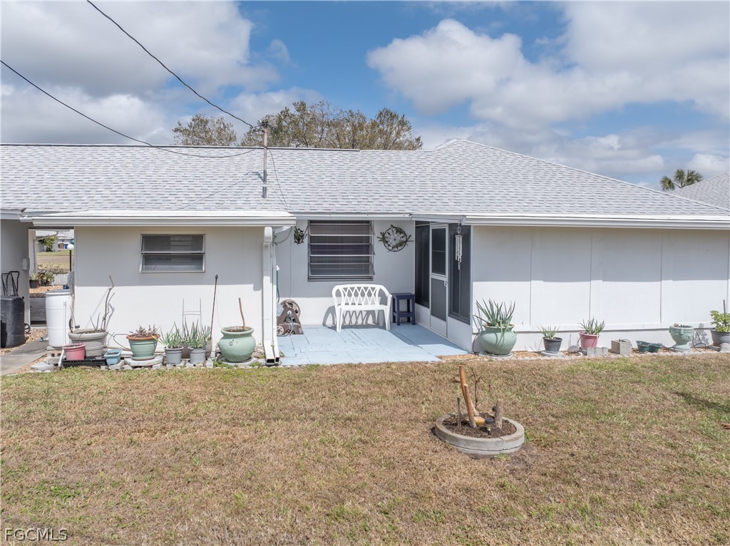 337 Richland Road Lehigh Acres, FL 33936 - Photo 28 of 31 a view of a house with backyard