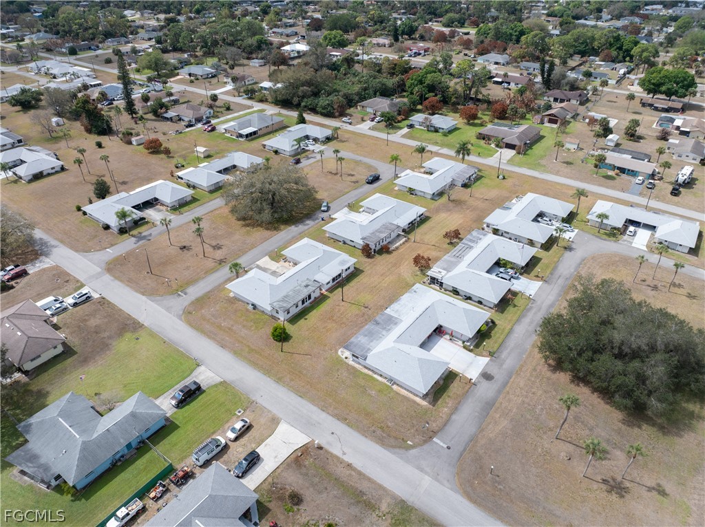 337 Richland Road Lehigh Acres, FL 33936 - Photo 29 of 31 an aerial view of residential houses with outdoor space