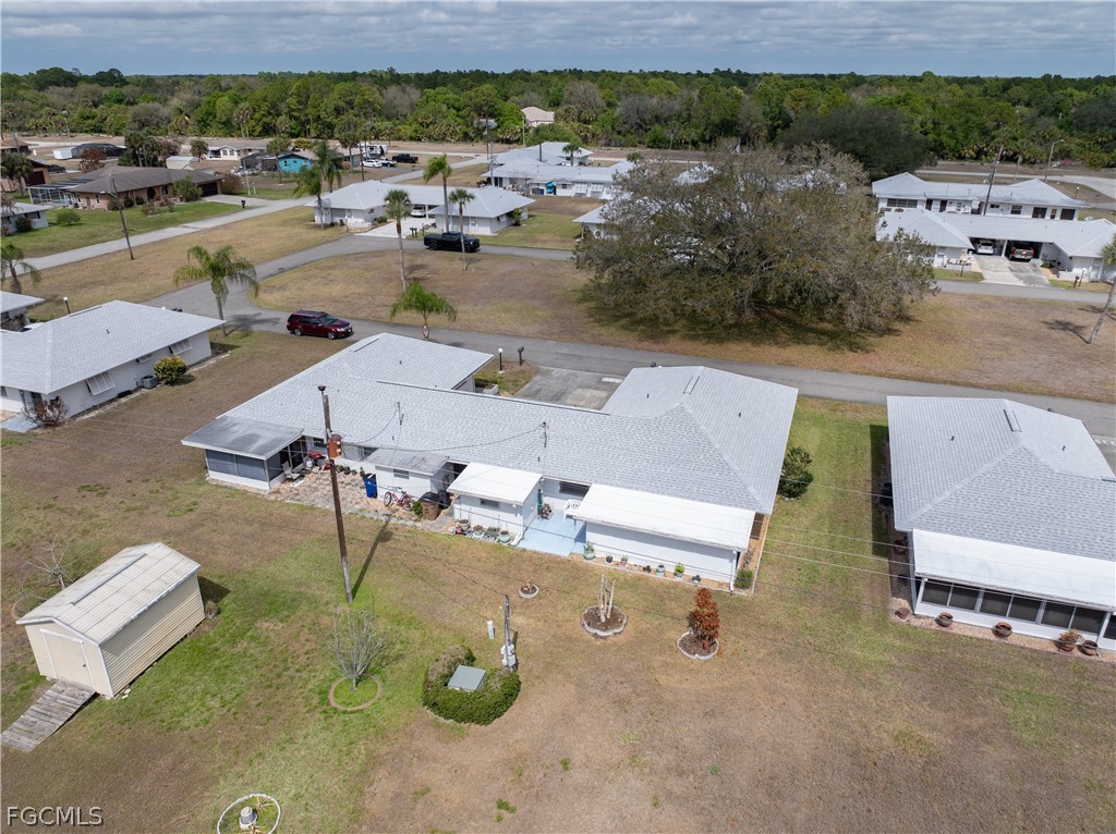 337 Richland Road Lehigh Acres, FL 33936 - Photo 30 of 31 an aerial view of a house with outdoor space