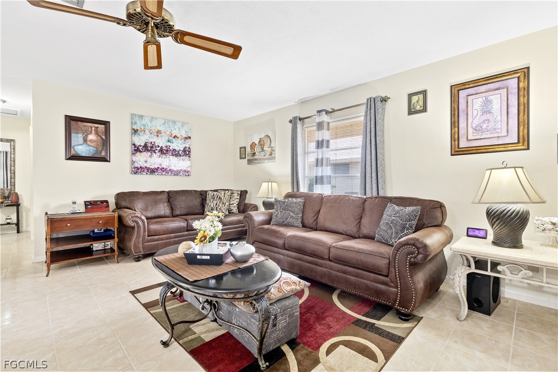 337 Richland Road Lehigh Acres, FL 33936 - Photo 6 of 31 a living room with furniture and wooden floor