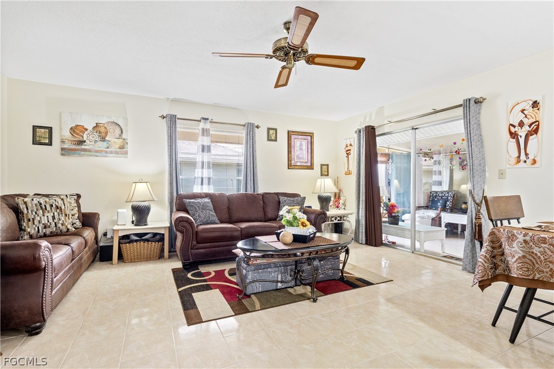 337 Richland Road Lehigh Acres, FL 33936 - Photo 7 of 31 a living room with furniture or couch and a window