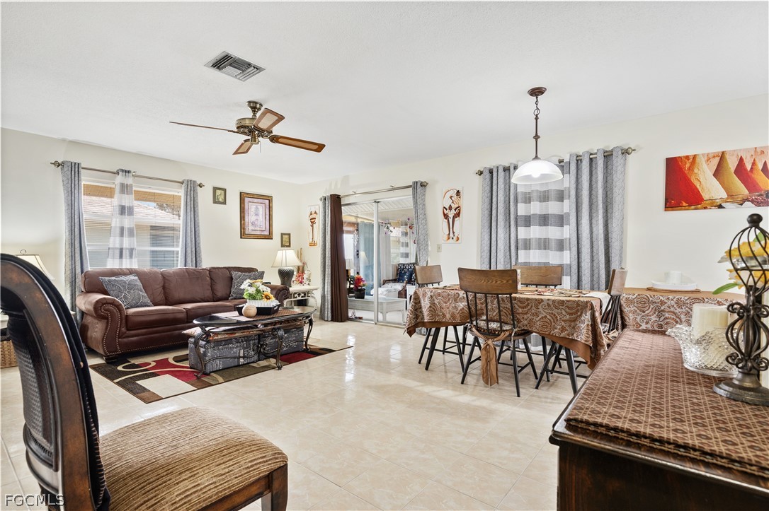 337 Richland Road Lehigh Acres, FL 33936 - Photo 9 of 31 a living room with furniture kitchen view and a window