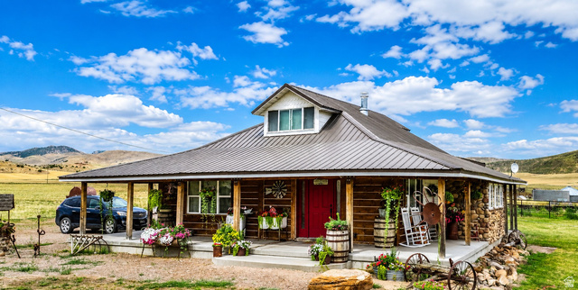 Expansive porch with a metal roof and exposed wood columns