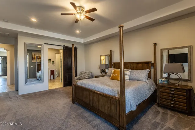 a bed room with a bed and dresser