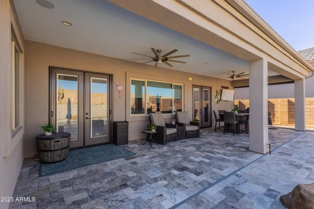 a view of a garden with lawn chairs