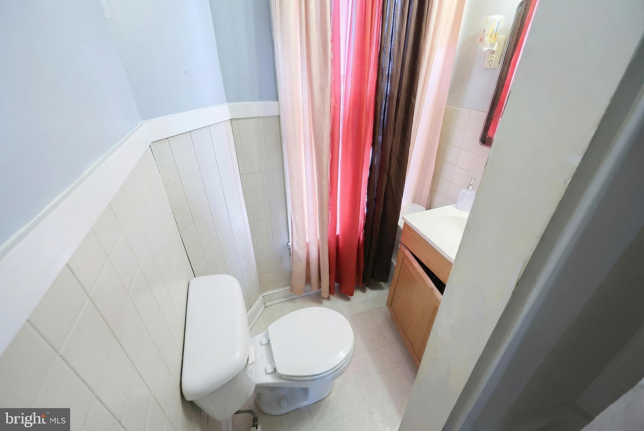 435 Walnut Street York, PA 17403 - Photo 5 of 11 a bathroom with a sink and a mirror