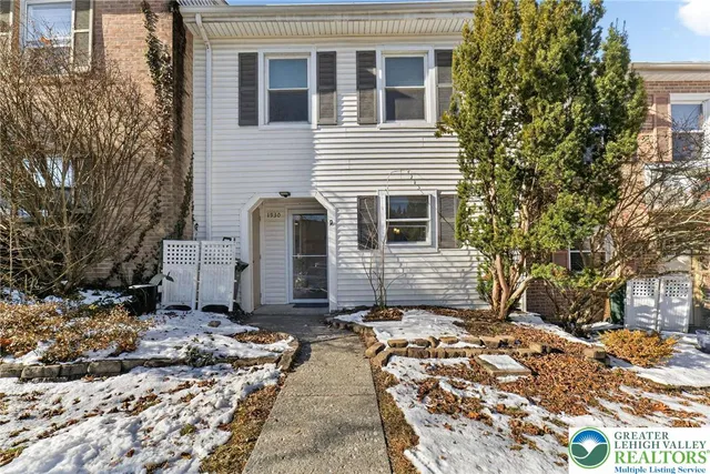 a picture of a bench in front of a wall