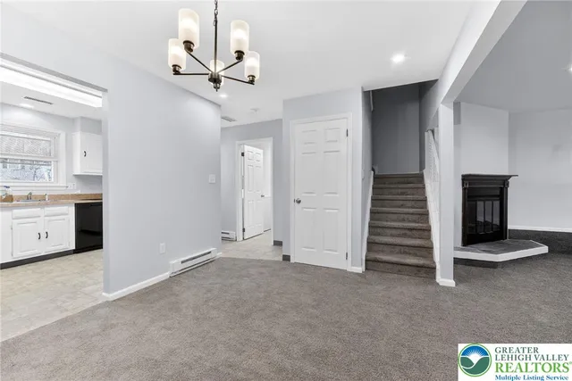 a view of an empty room with a fireplace